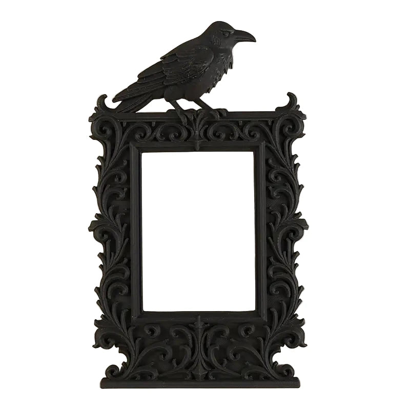 Black The Dark Arts: Crow Photo Frame with A black, ornate photo/picture frame with crow detail. Wooden frame. Measures x in a go.