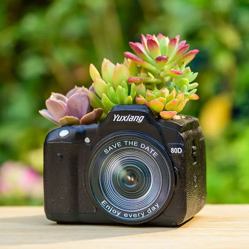 Modern Camera Planter with Shaped pot plant holder/planter. Plastic resin in a gothic alternative style.
