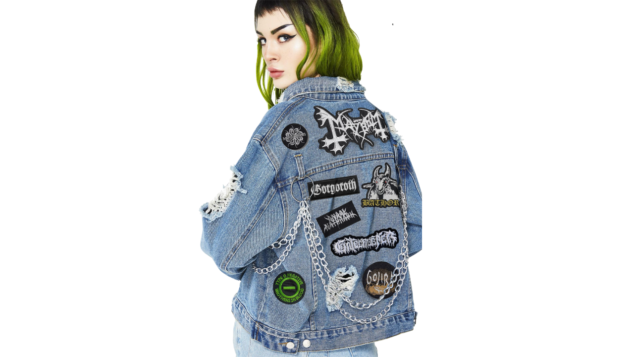 Denim jacket with various patches worn by a person on a white background