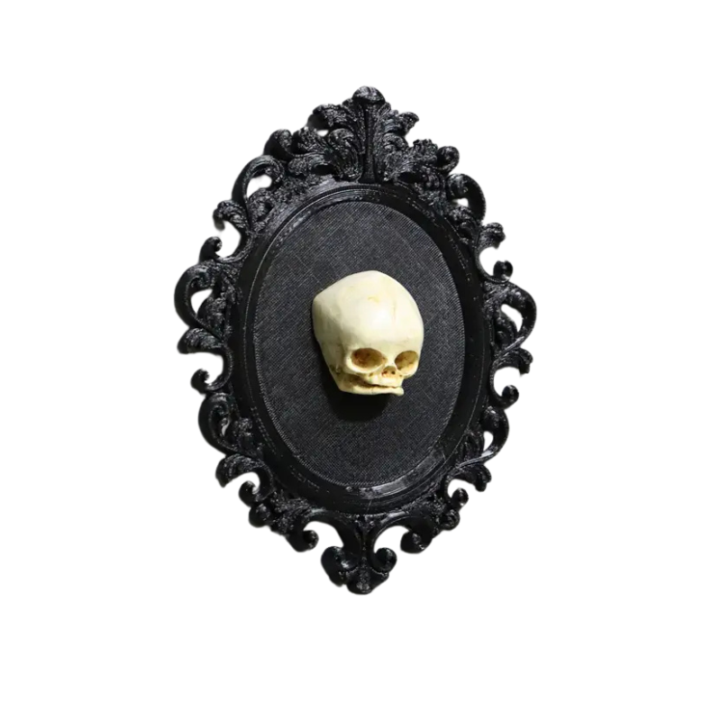 Black Framed Baby Skull with Ornate black framed baby skull. 3D. Plastic resin. Flat back in a gothic alternative style.